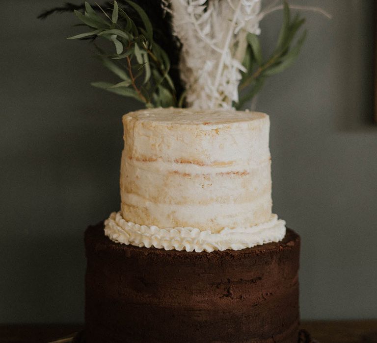 Two tier semi-naked two tone chocolate and vanilla wedding cake 