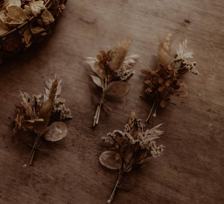 Dried flower buttonholes with dried confetti