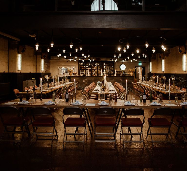 Rustic wedding reception setting at The Mowbray complete with wooden tables and simplistic tablescape styling 