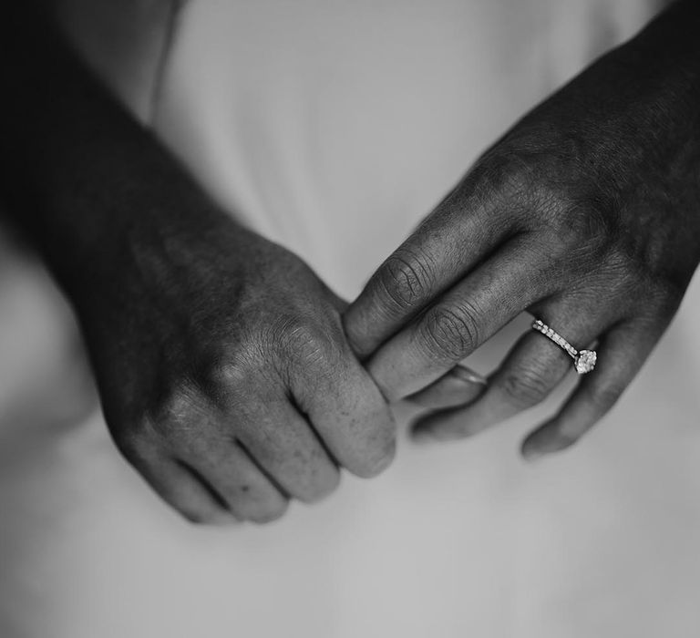 Bride wears a diamond engagement ring 