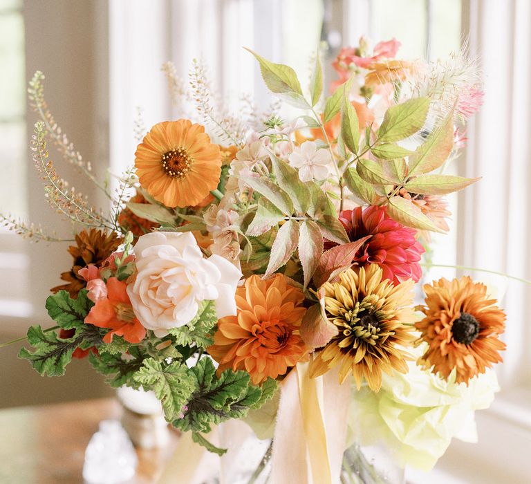 Colourful wedding bouquet with dahlias and roses 