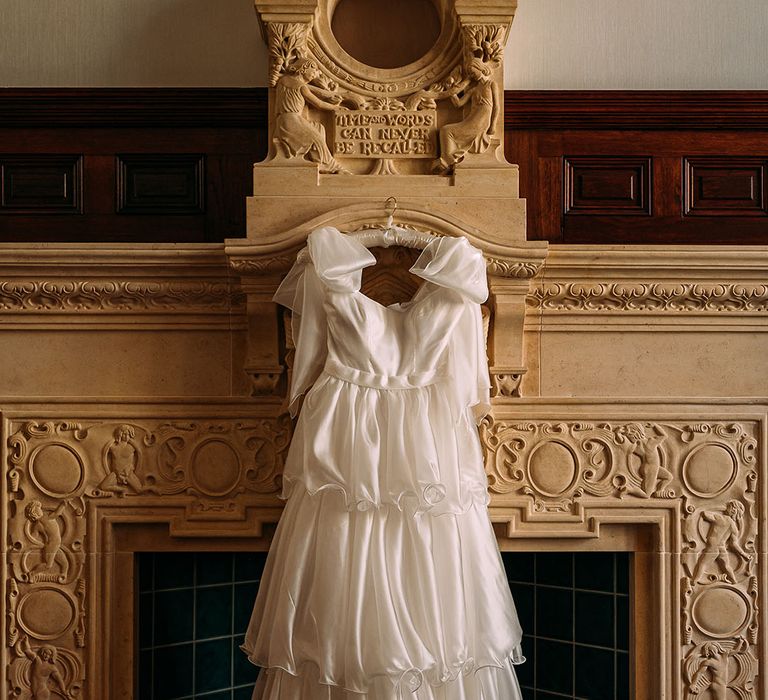 Bride in ruffle wedding dress with bow straps by Emma Beaumont 