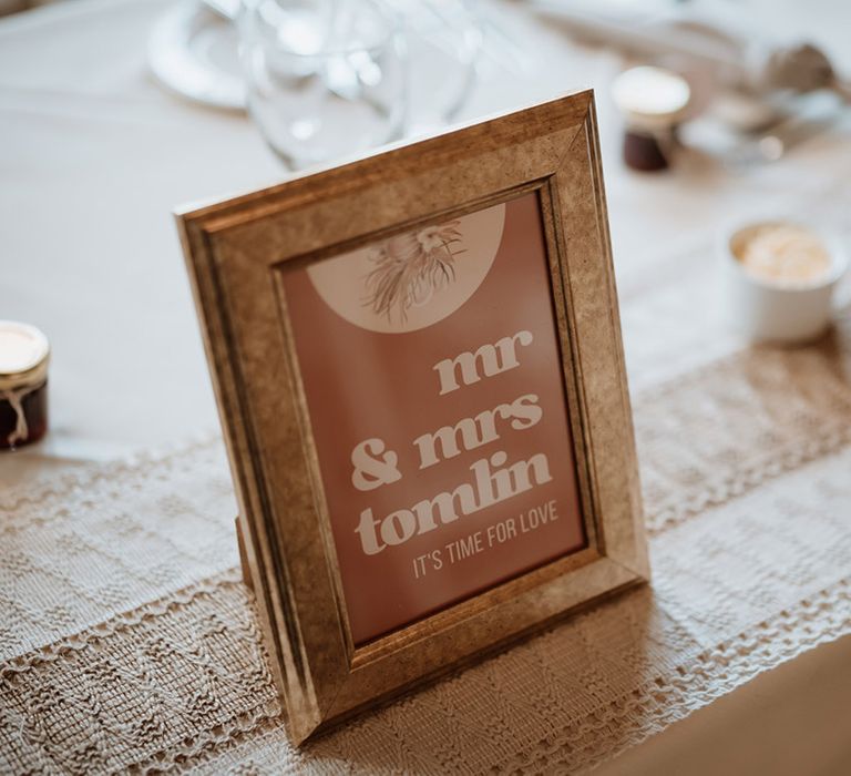 Sweetheart top table for the bride and groom with their own table name sign