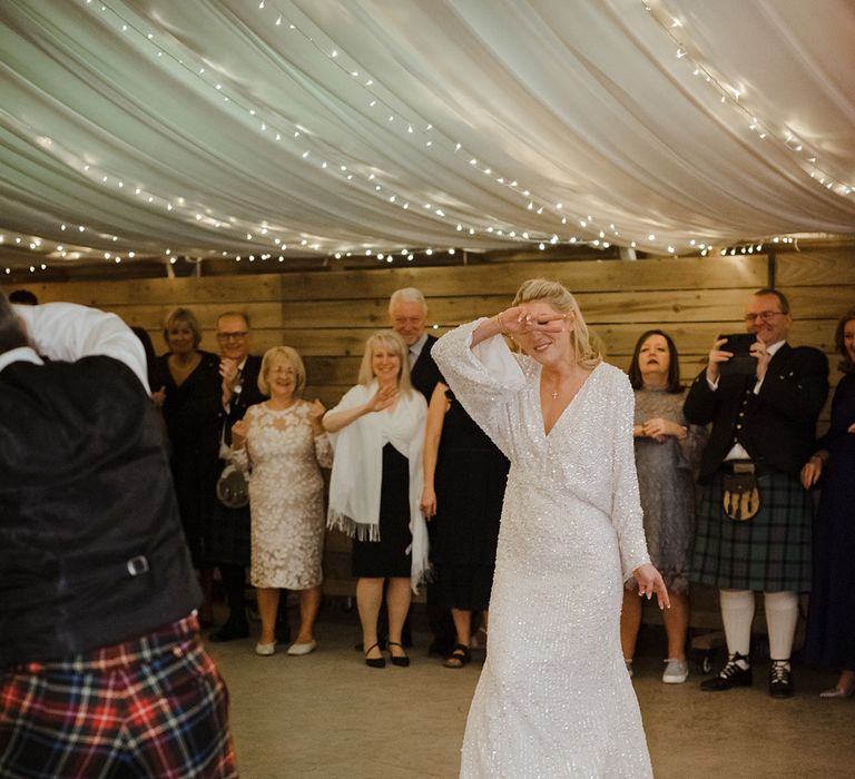 The Cowshed Crail wedding with marquee and the bride and groom having their first dance together