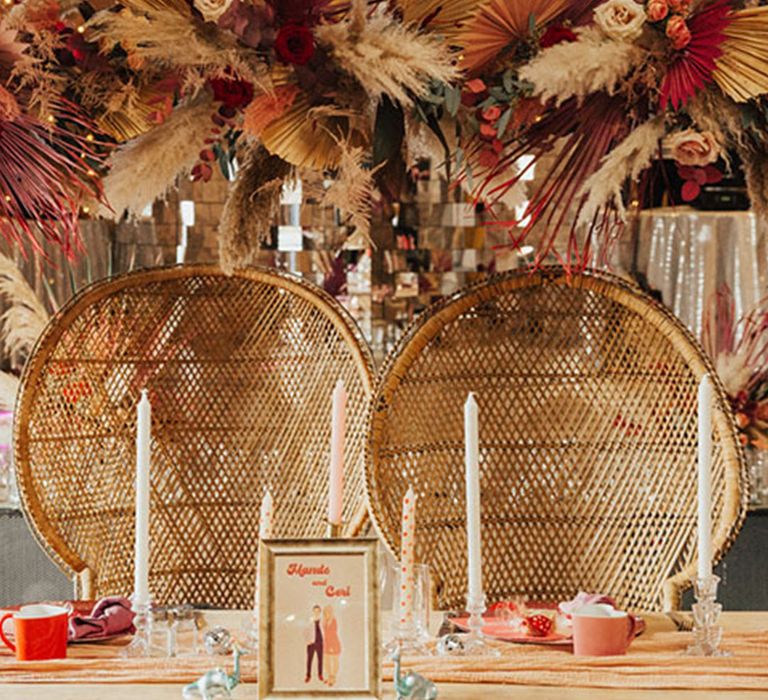 Sweetheart table for boho wedding with retro styling and dried wedding flower decorations 