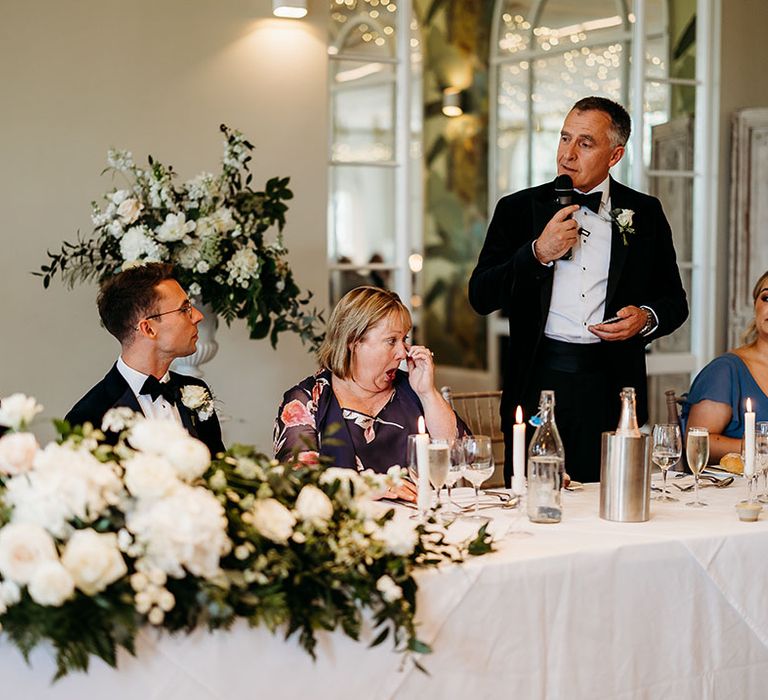 Father of the groom reads out his wedding speech 