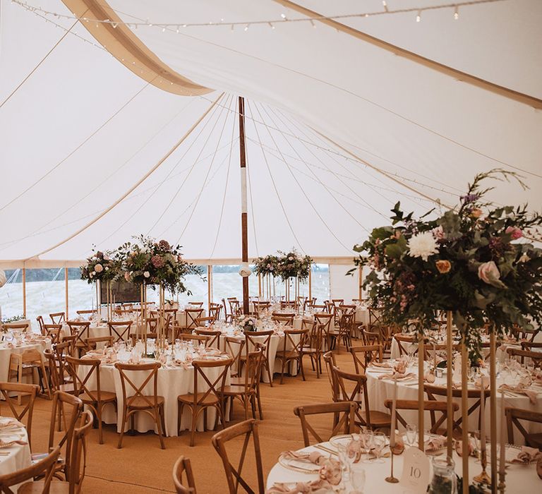 Marquee wedding reception with pink and white wedding flowers 