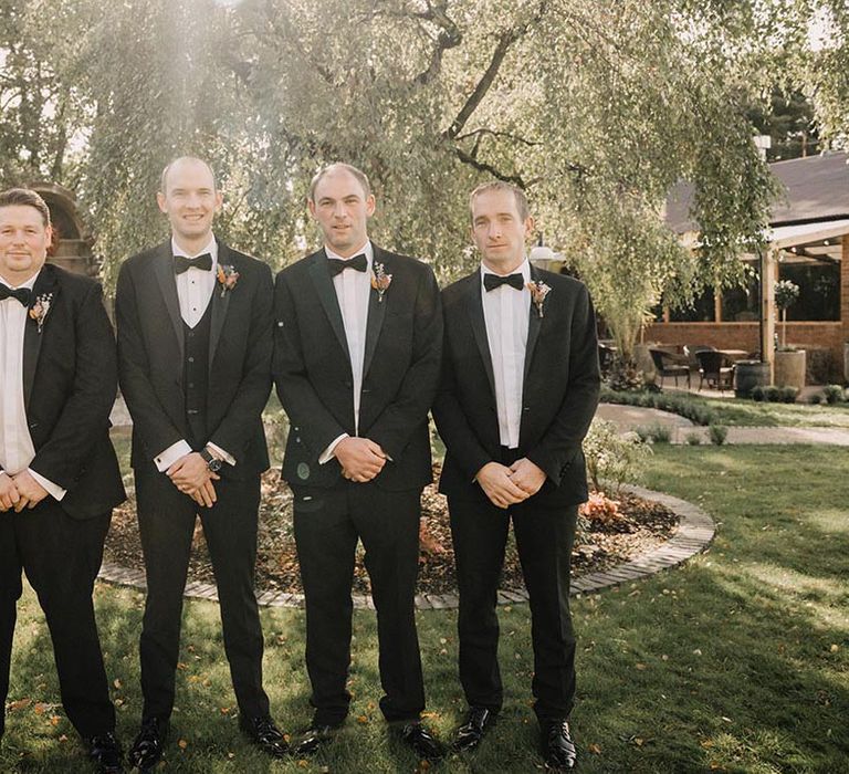 Groomsmen in traditional black tuxedos for wedding day in Northern Ireland 