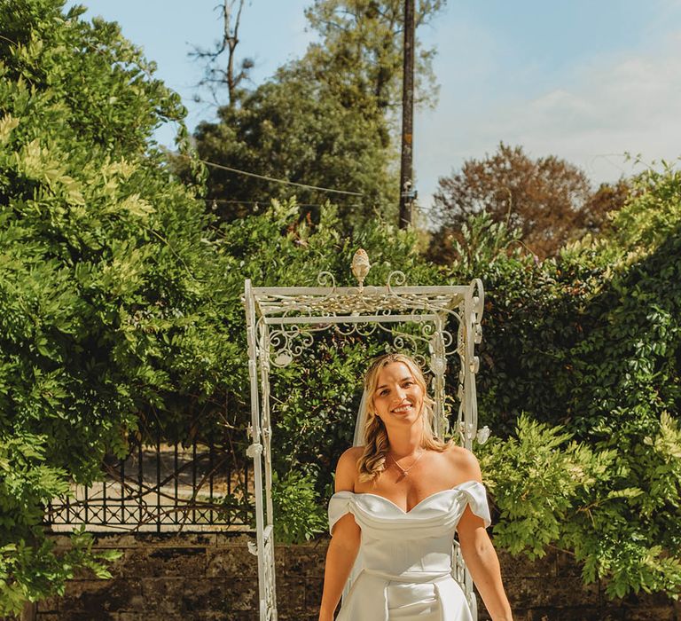 Summer wedding in France with the bride wearing an off the shoulder wedding dress 