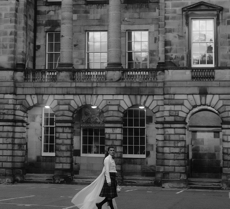 Black and white photo of the bride and groom outside of Signet Library wedding venue 