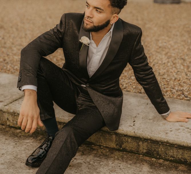 Groom in velvet tuxedo at Gosfield Hall