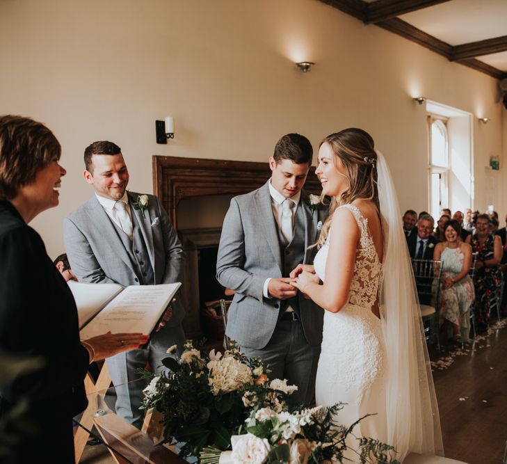 Bride and groom exchanging vows at Notley Abbey wedding ceremony 