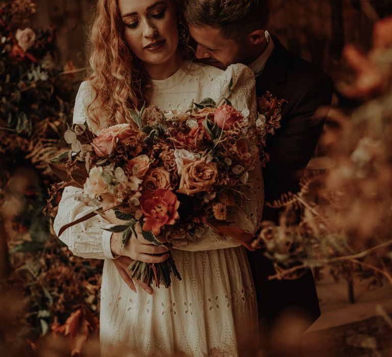 Autumn wedding bouquet with blush and orange wedding flowers 