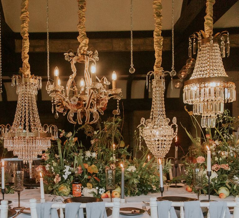 chandelier light installation over the wedding table 