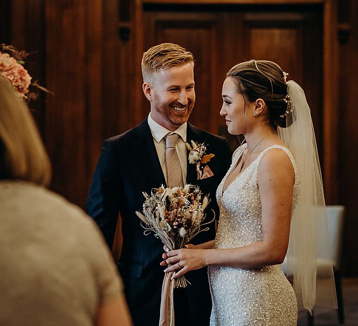 Bride and groom exchanging vows at intimate Town Hall wedding 