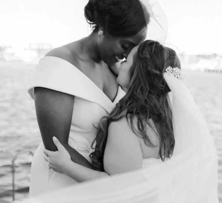 Black and white intimate photography of same sex wedding couple 