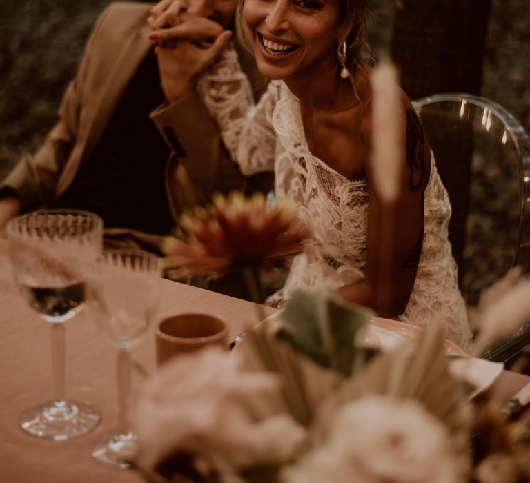 Beautiful bride with messy bun wedding hairstyle and natural makeup 