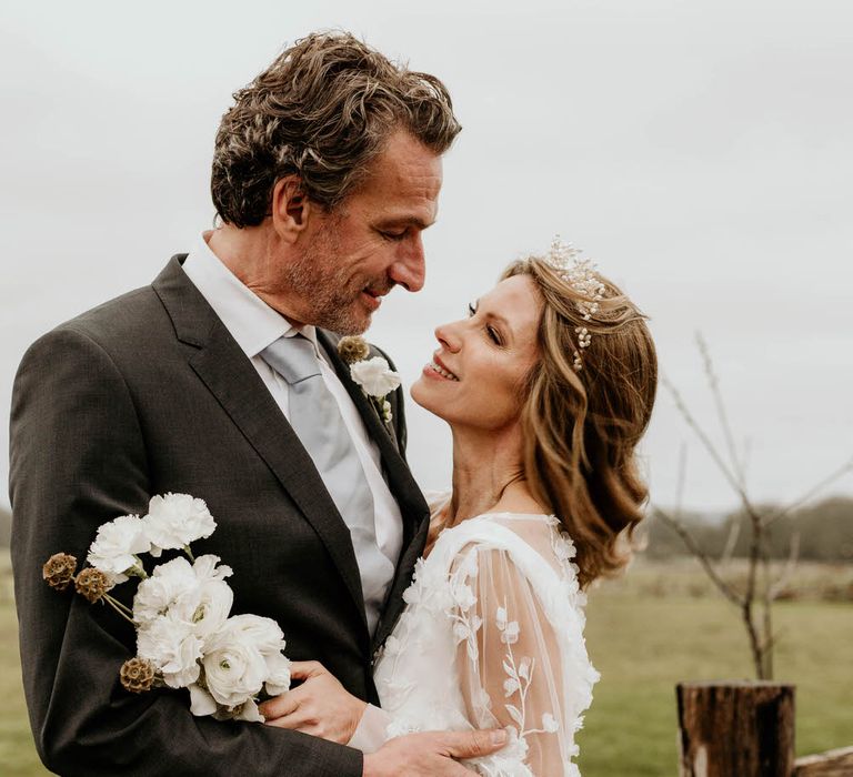 Bride and groom in the countryside at High Billinghurst Farm for a rustic luxe wedding venue