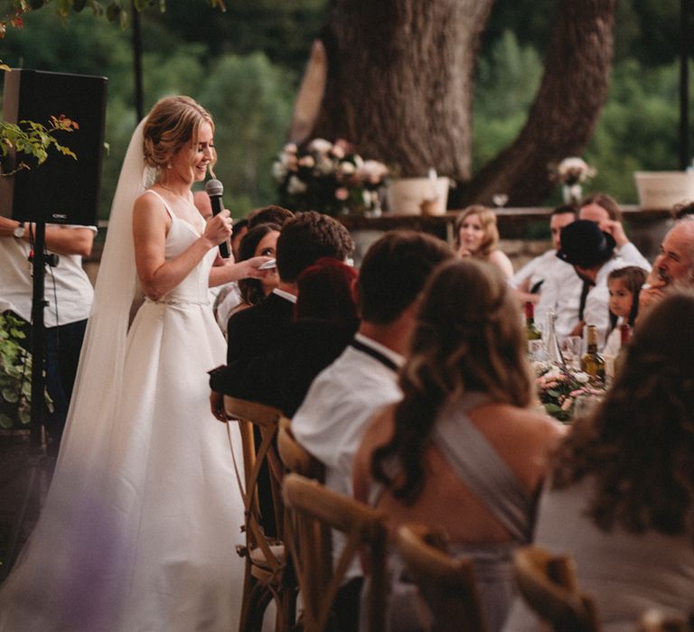 Brides speech at outdoor wedding reception at Chateau Lagorce 