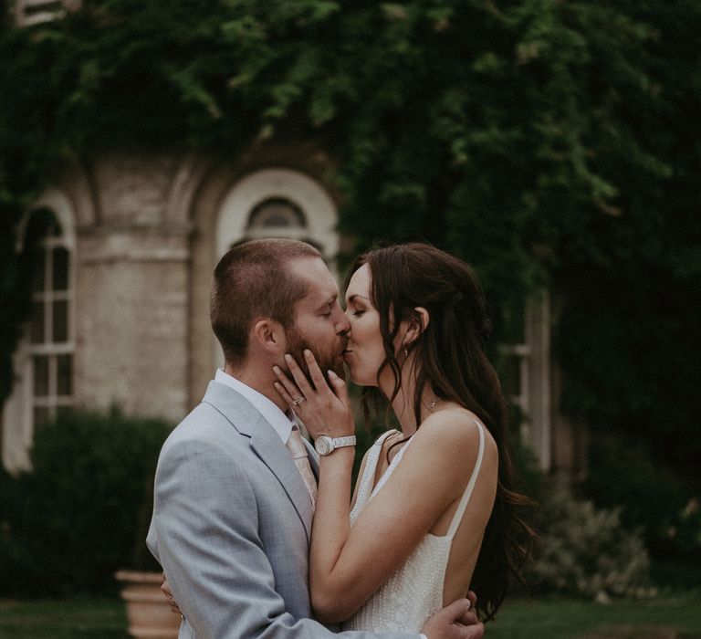 Bride and groom kiss at Hampshire wedding