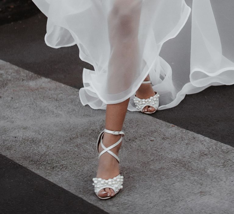 Sheer layered skirt and Charlotte Mill pearl wedding shoes 