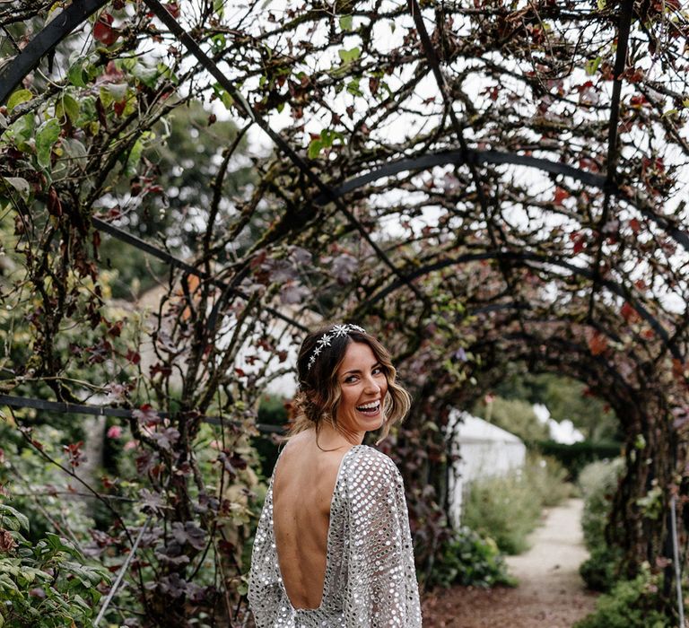 Stylish bride in a Tilly Thomas Lux crown and a silver sequin, Chosen By Kyha, wedding dress