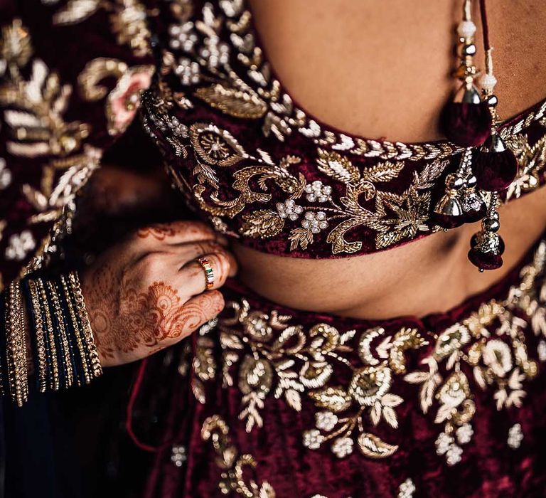 Beautiful detailed burgundy wedding dress with gold embellishment