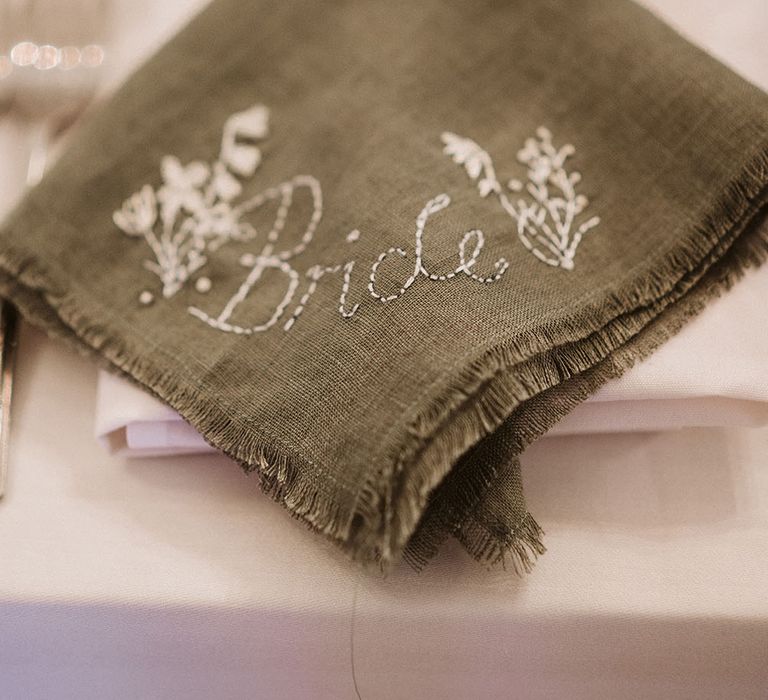 Handmade embroidered green napkins finished with floral embroidery and name