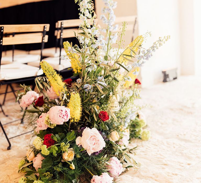 Colourful wedding flower aisle decoration 