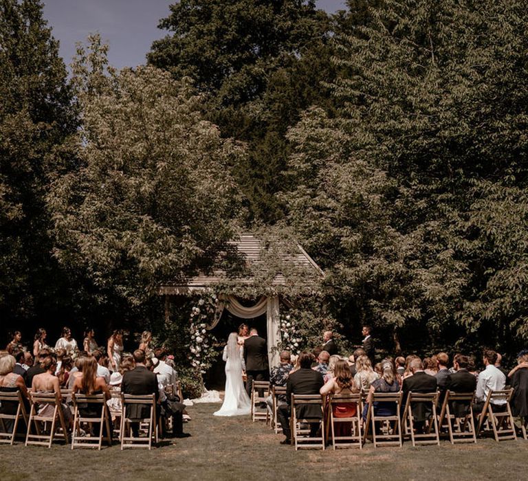 Outdoor wedding ceremony at Pennard House wedding venue 