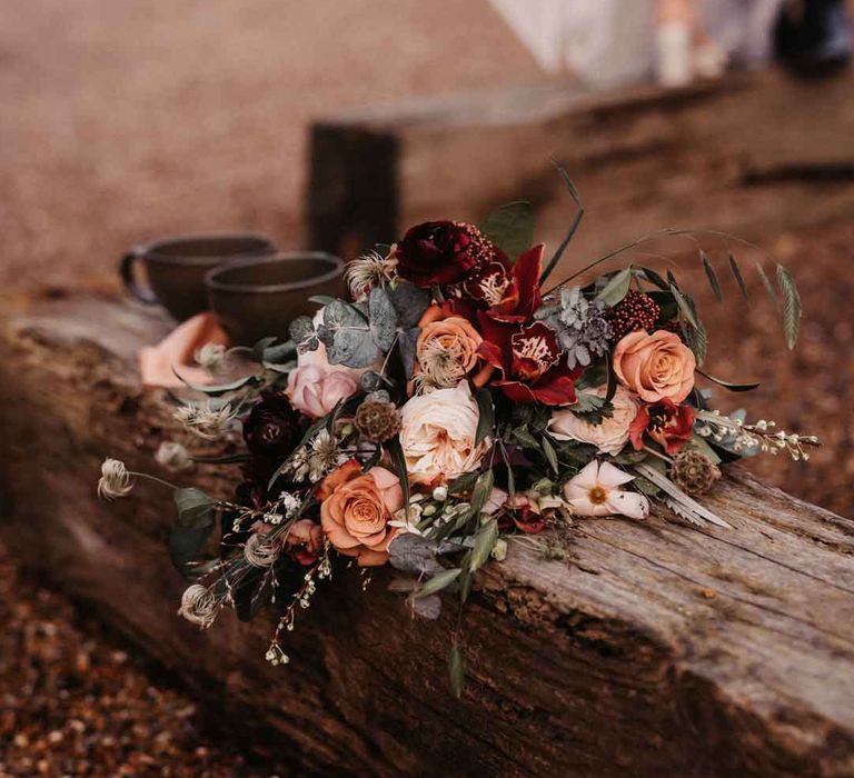 Rose, carnation, dried flower, eucalyptus and baby's-breath bridal bouquet 