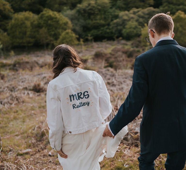 DIY wedding denim jacket with personalised new last name on the back of the jacket 