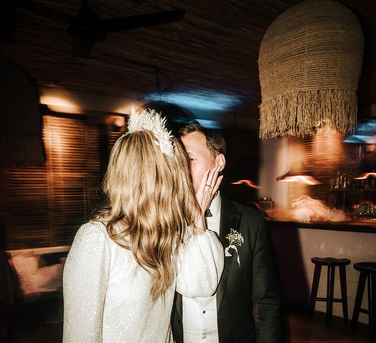 bride in a short sparkly wedding reception dress and flower headband at pure house ibiza reception