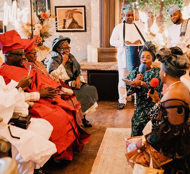 Interfaith wedding with Nigerian wedding ceremony traditions at hotel wedding venue 