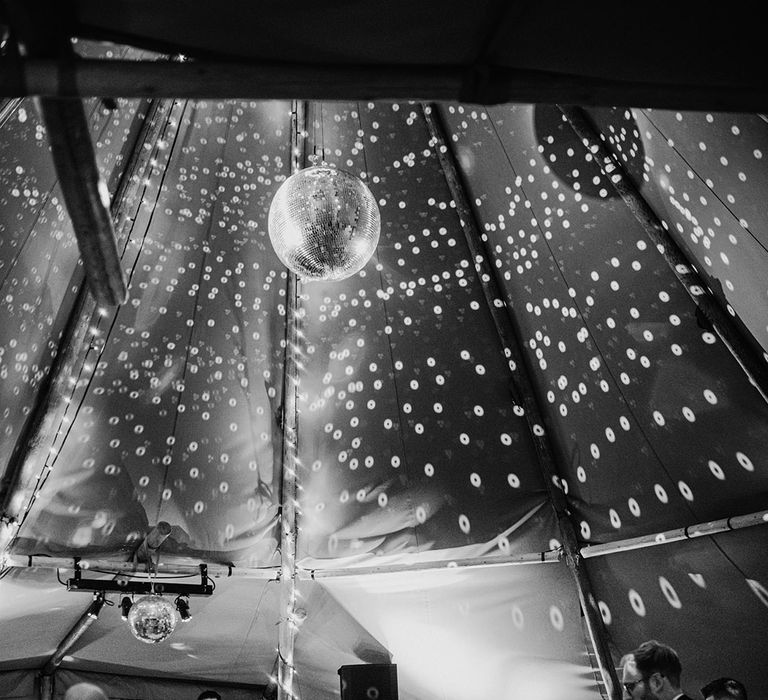 Tipi wedding with disco ball for reception over the dance floor 