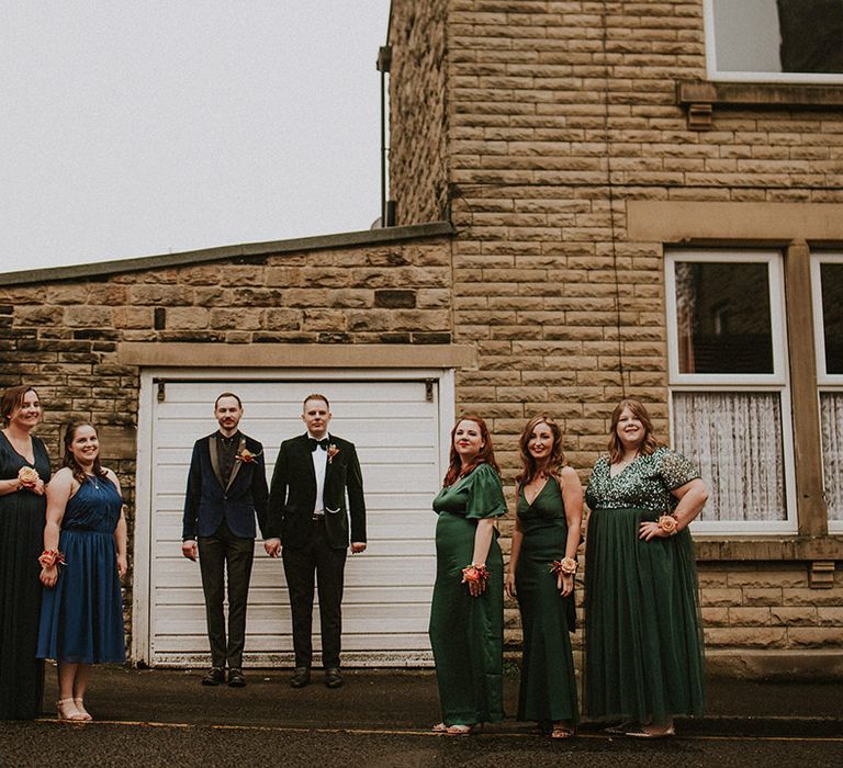 The Loft and Workshop wedding in Yorkshire with two grooms and groomsmaids in blue and green dresses 