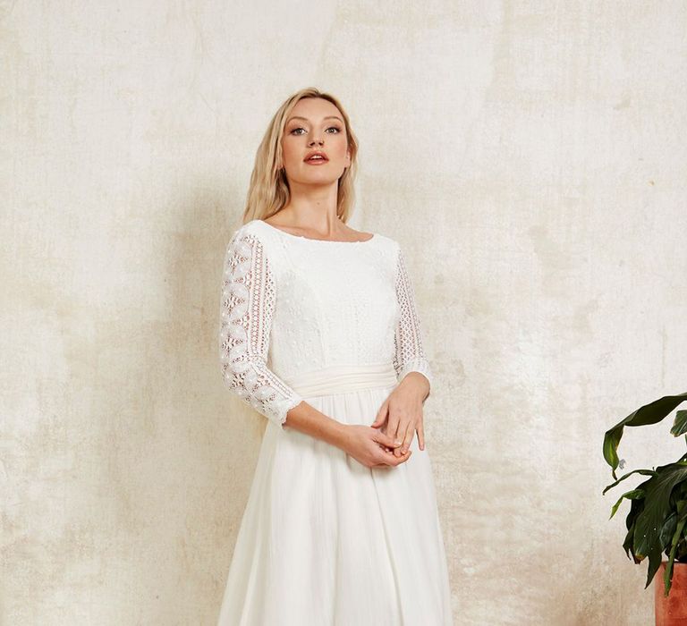 Sustainable wedding dress with long lace sleeves and silk waist sash from Indiebride London in boho style