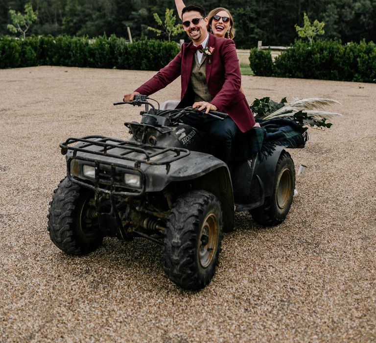 wedding portrait by Epic Love Story of a bride and groom riding a quad bike