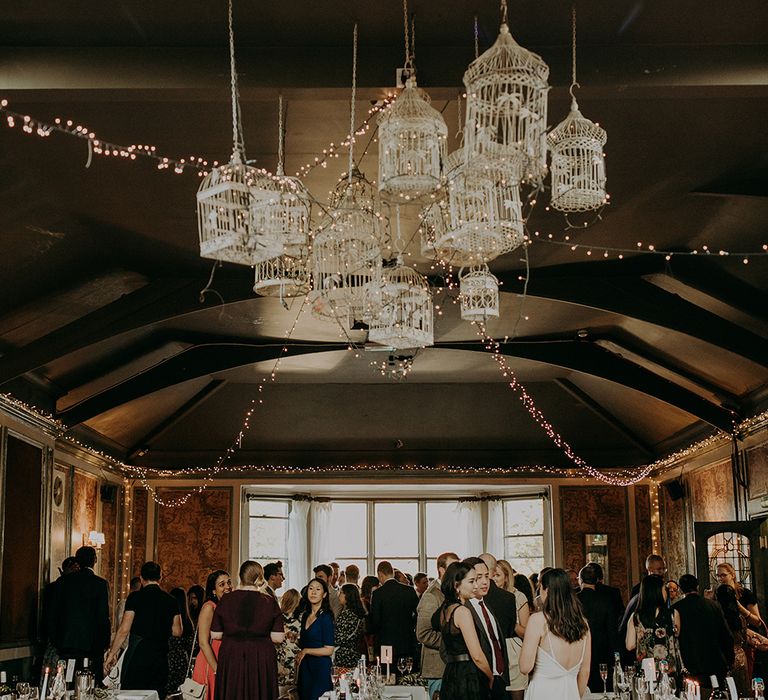 Bird cage and disco ball decor at Balham Bowls Club