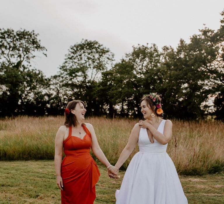 Bride in David's Bridal gown and Bridesmaid in red dress