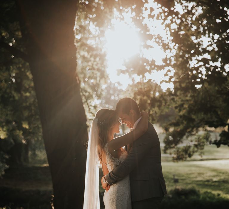 Golden hour bride and groom portrait by Natalie J Weddings 