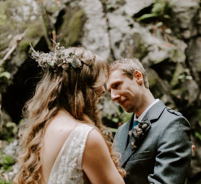 Bride and groom gaze at each other as they are surrounded by nature in a Perthshire forest