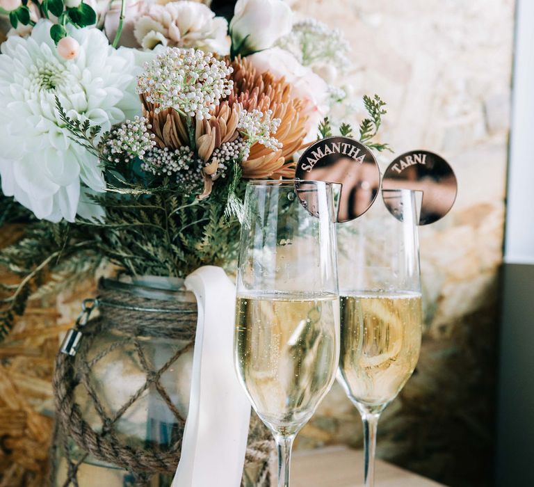 Beautiful blush wedding flowers and champagne