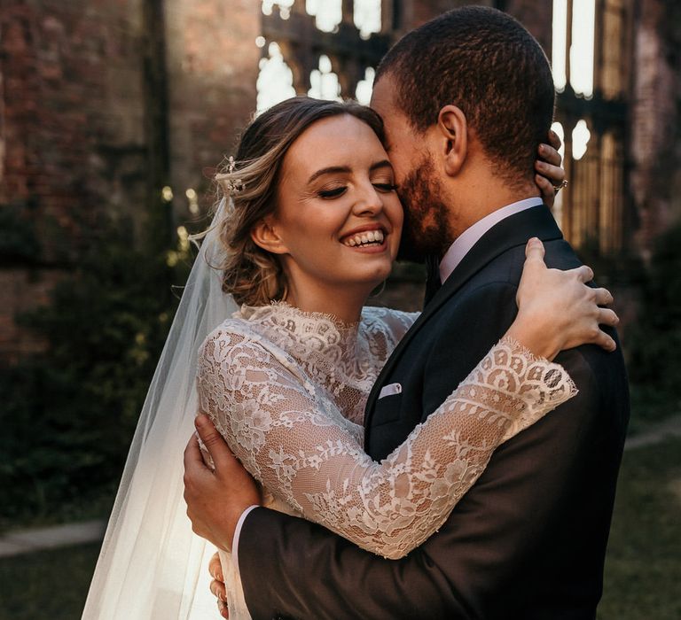 Golden hour portrait with the sun shining through the open air bombed out church 