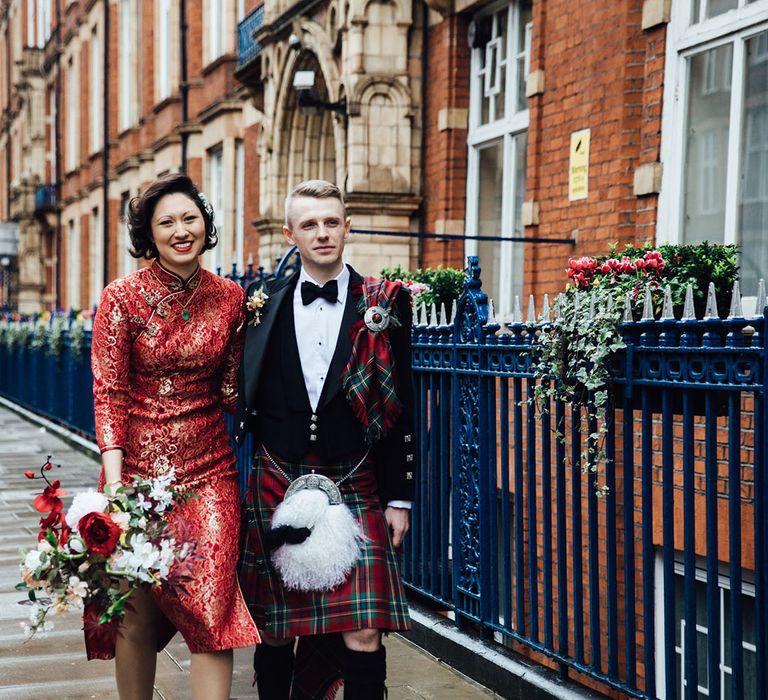 Groom wears white feather sporran with kilt