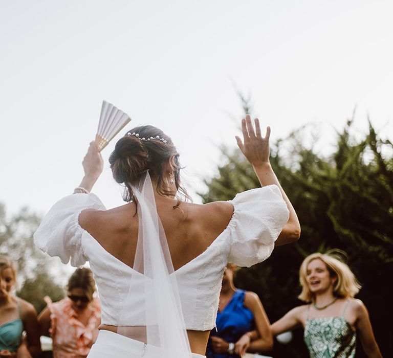 Bride dancing to celebrate her marriage