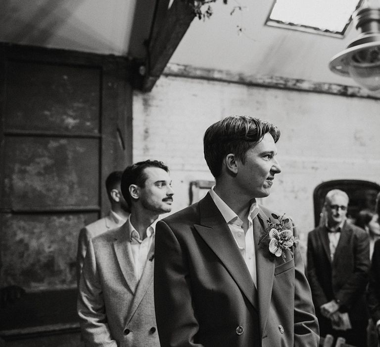 Groom turns to get his first look at the bride 