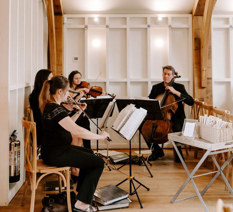 String quartet playing during the wedding ceremony 