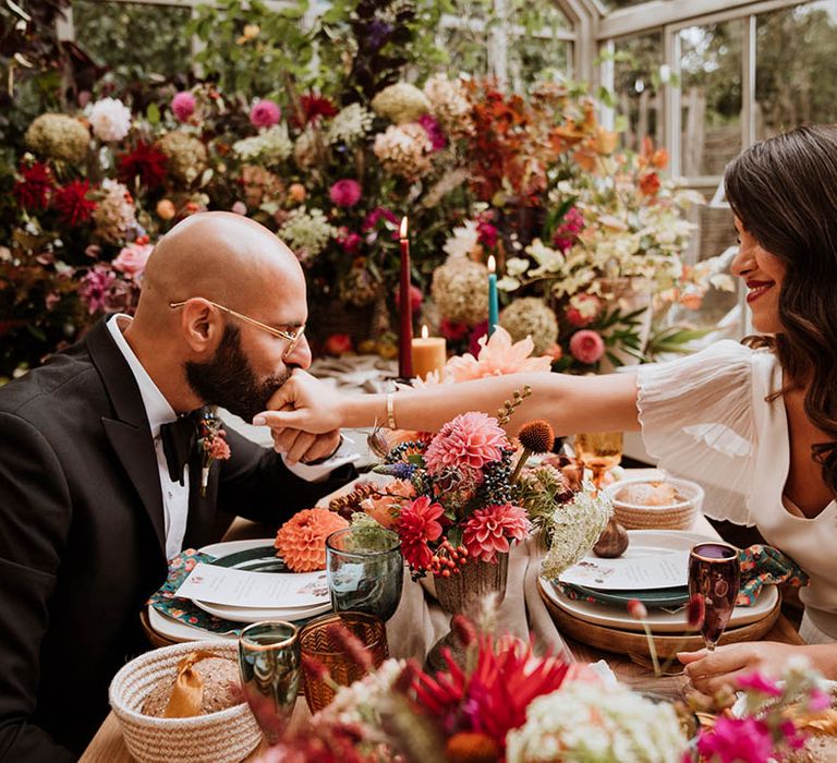 Bride and groom sharing intimate wedding dinner at Le Manoir Aux Quat Saisons - luxurious intimacy