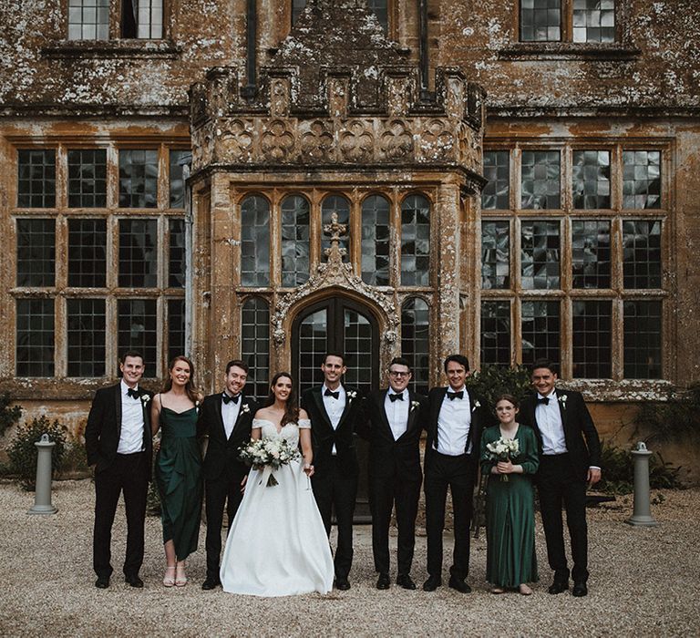 Bride and groom with their wedding party with a man of honour and groomswoman 